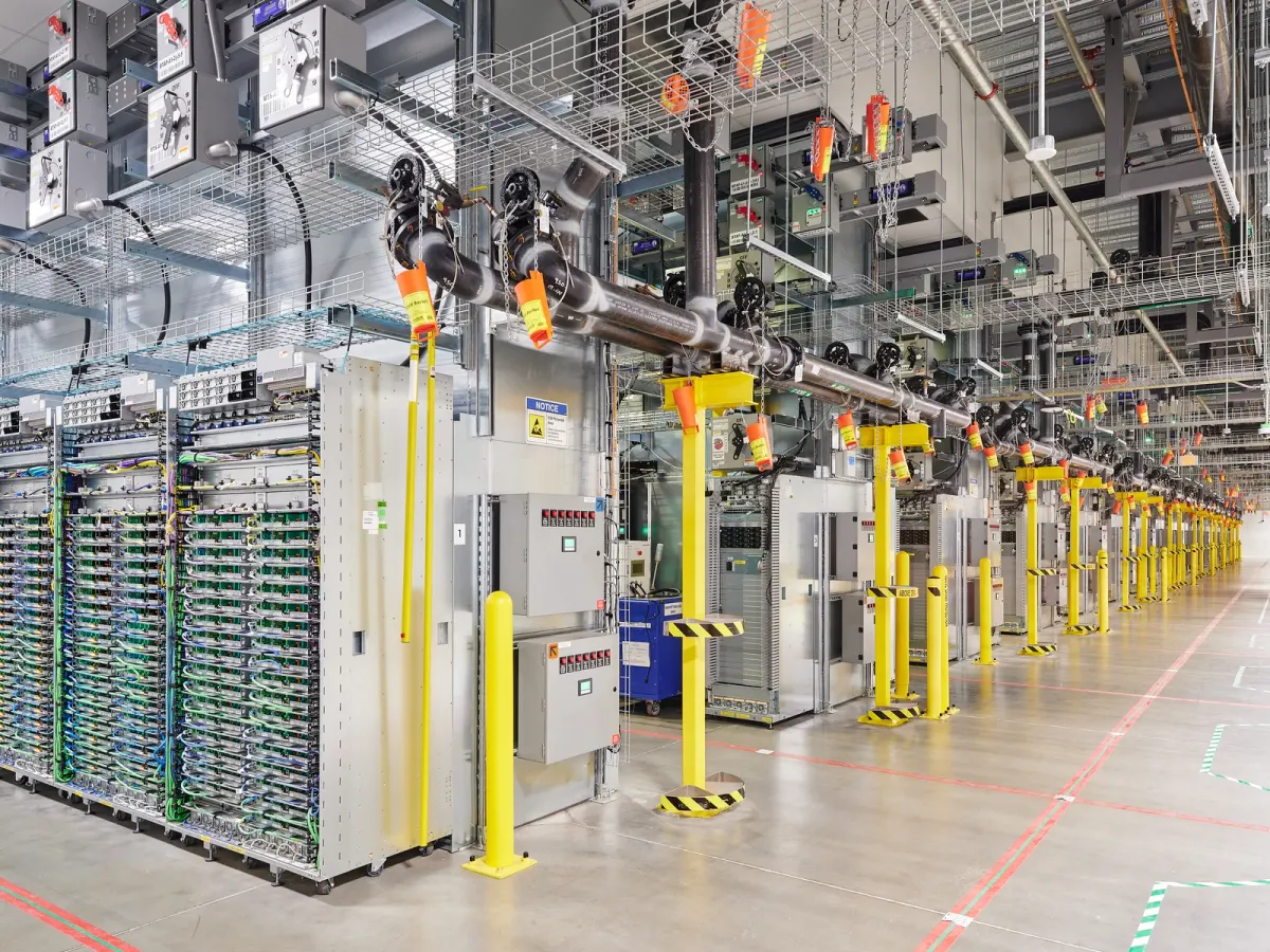 Server aisles and overhead infrastructure inside Google's New Albany data center in Central Ohio