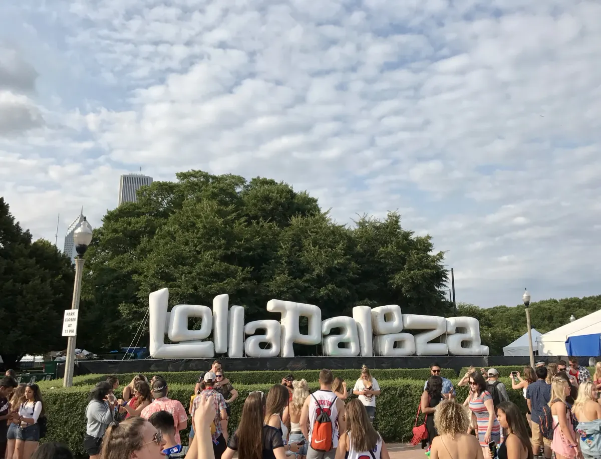 Visitors gather by Lollapalooza's Chicago welcome sign in an archival 2017 photograph