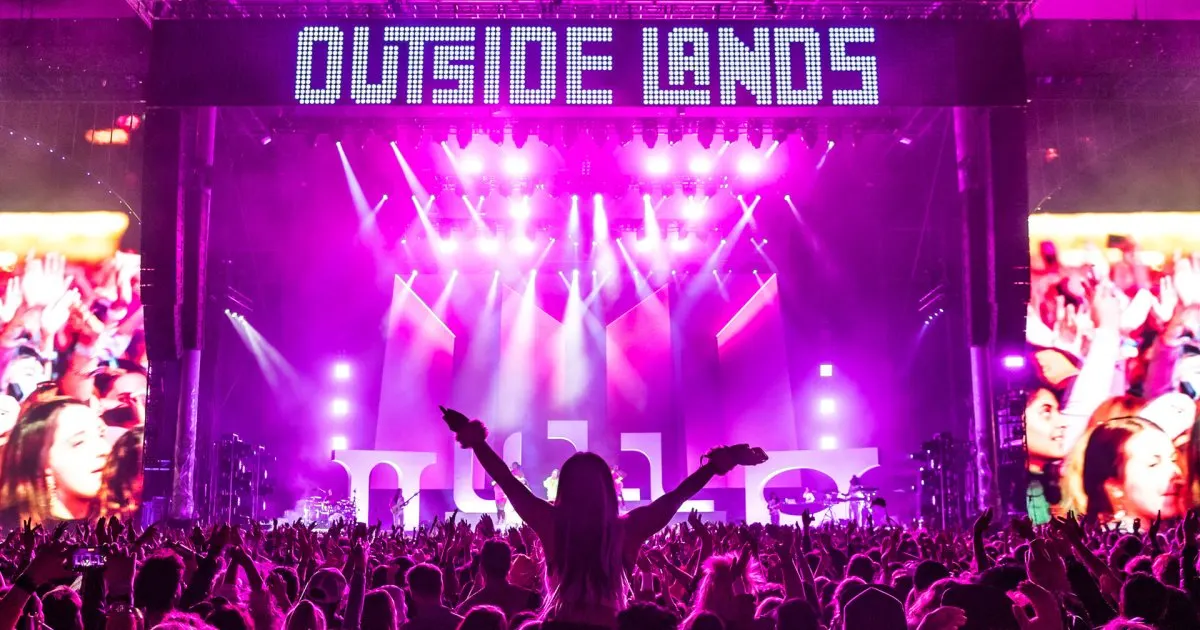 An archival Outside Lands crowd faces the festival stage at night