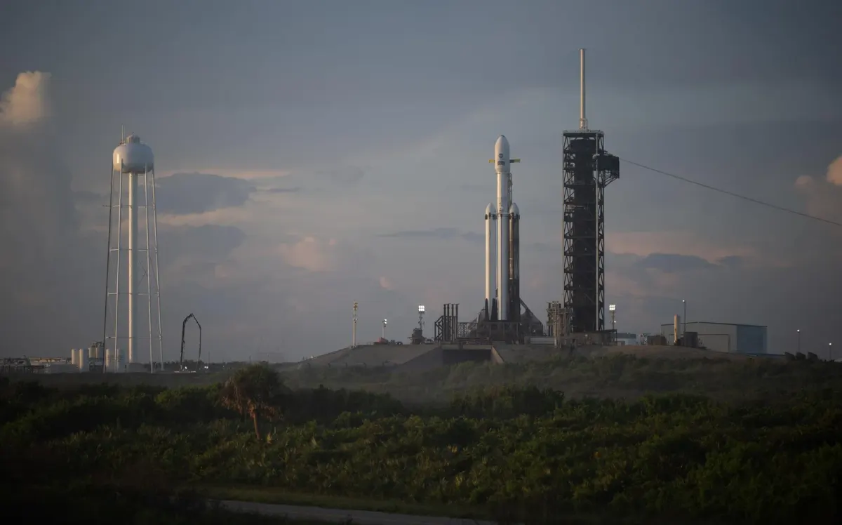 A Falcon Heavy rocket carrying the Roman Space Telescope stands on pad 39A at sunrise on August 29, 2026