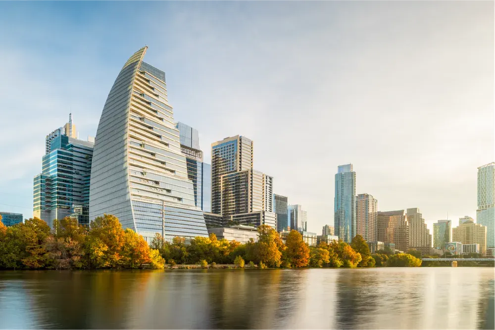 Google's sail-shaped office tower rises above Lady Bird Lake in downtown Austin