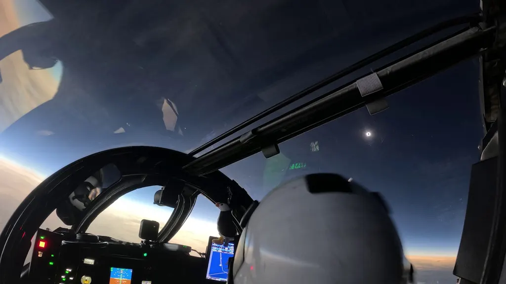 The August 12 total solar eclipse seen through the cockpit canopy of NASA's WB-57 aircraft near Iceland