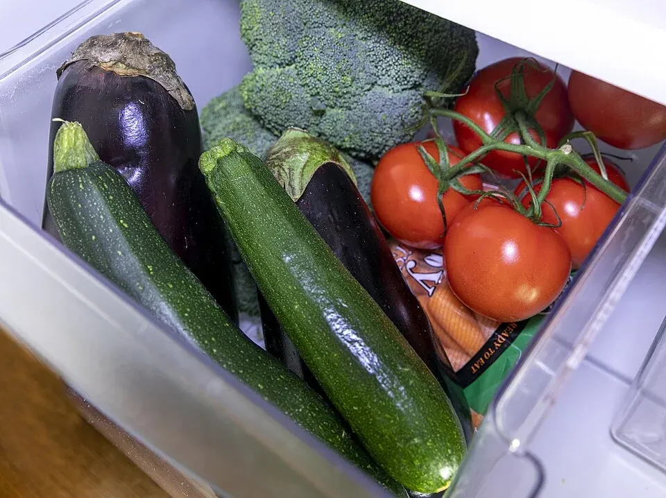 Fresh vegetables stored in a refrigerator drawer