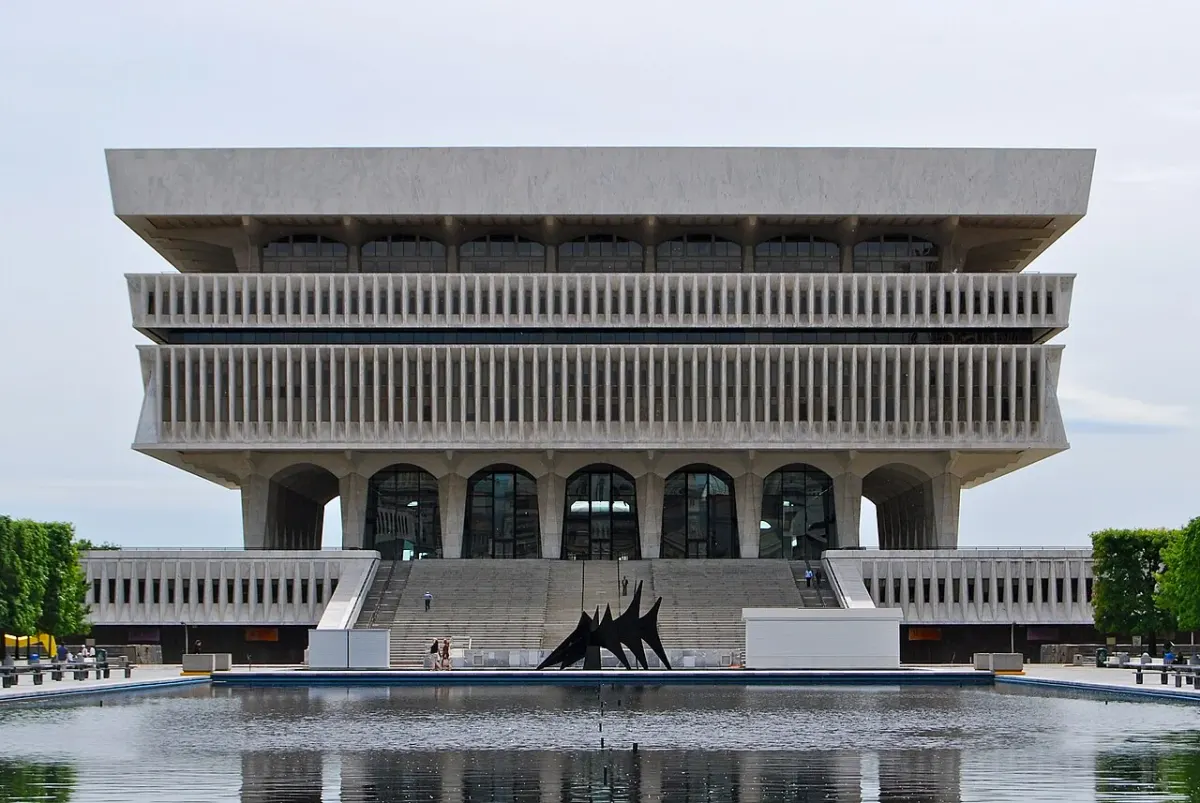 The projecting upper floors and plaza of New York State’s Cultural Education Center