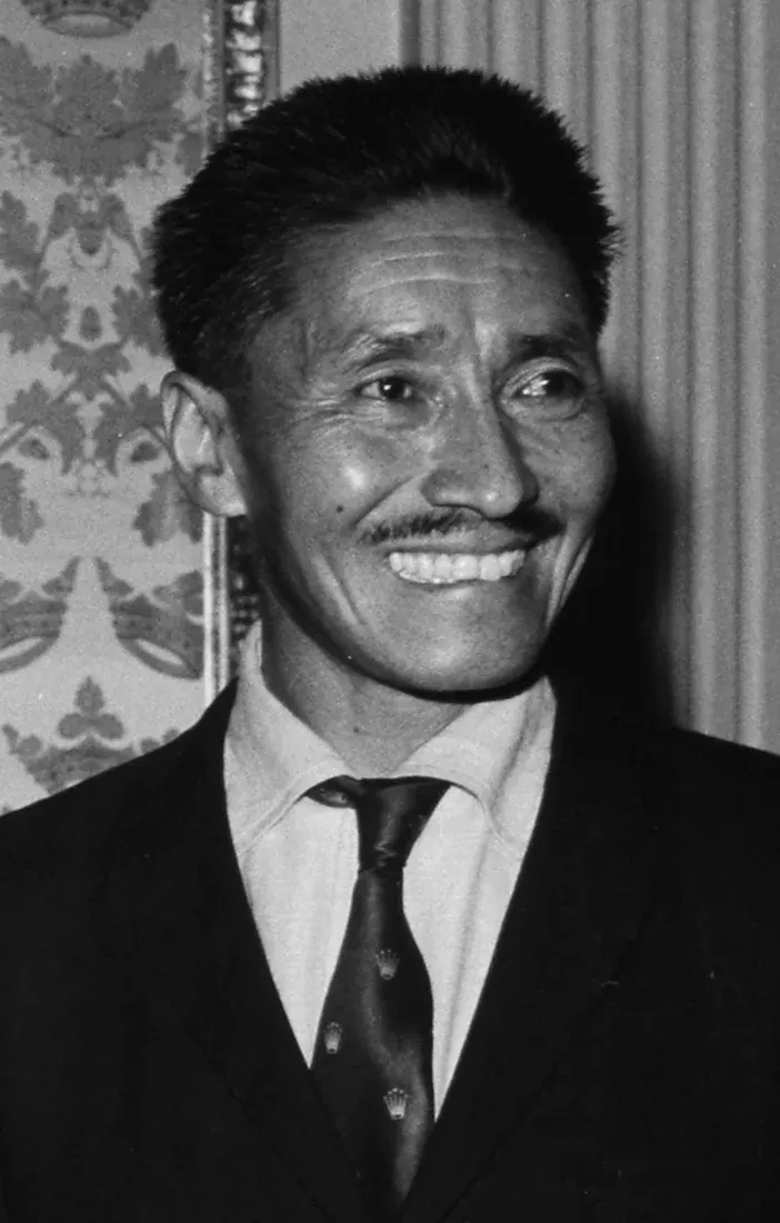 Black-and-white portrait of Tenzing Norgay wearing a suit