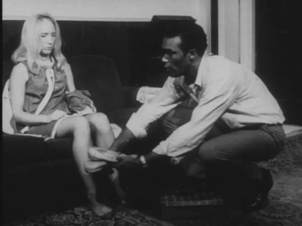 Ben gives Barbra slippers in a black-and-white farmhouse scene