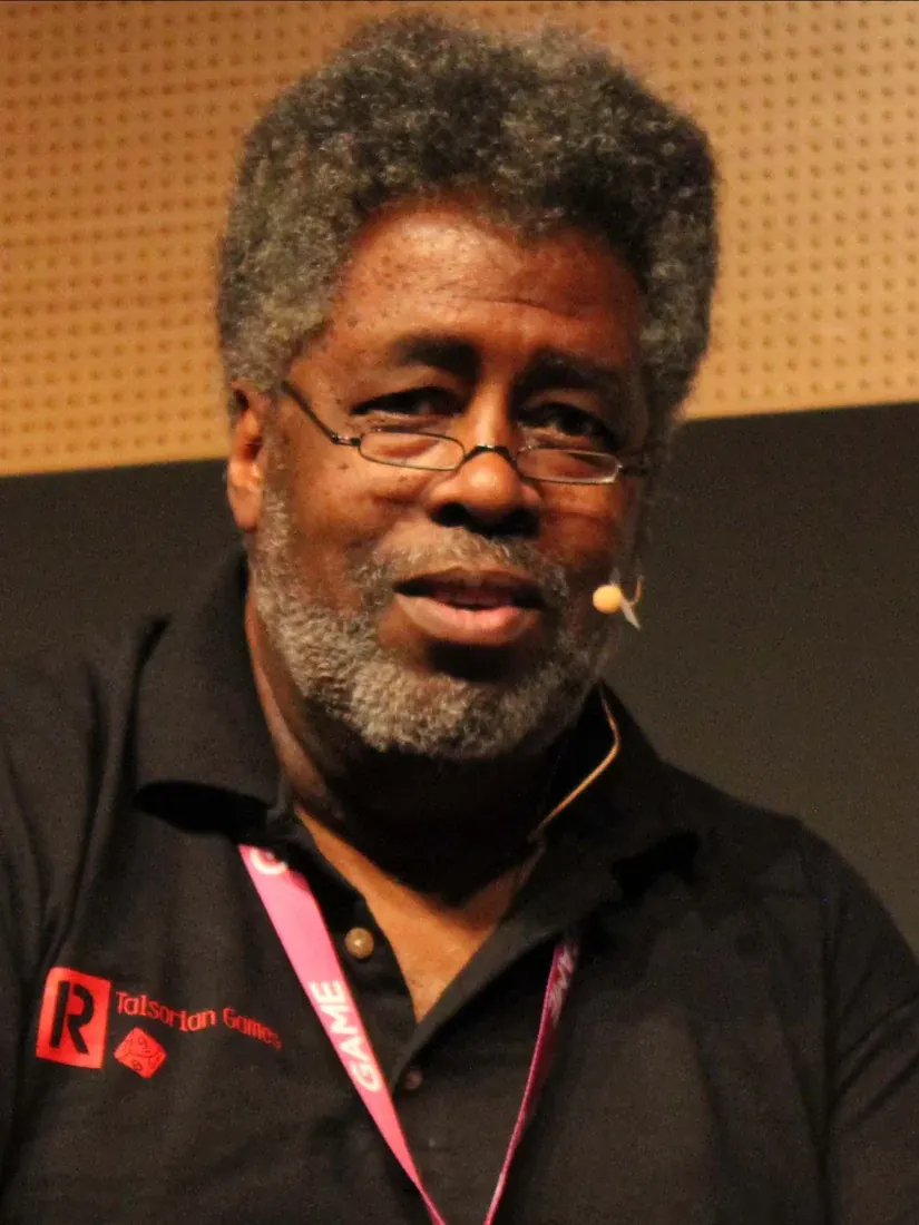 Mike Pondsmith wearing a headset microphone at a game industry event