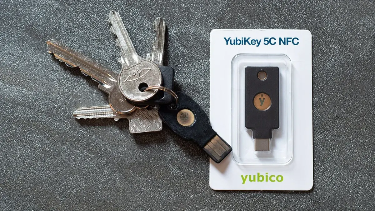 Packaged YubiKey 5C NFC security key beside a ring of house keys