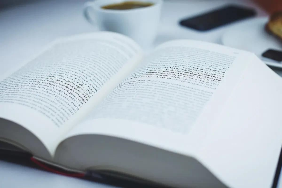 An open book on a table, photographed in 2016
