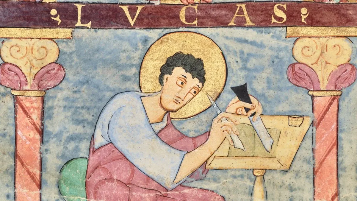 Saint Luke seated at a writing desk in the eleventh-century Irmengard Codex at the Getty