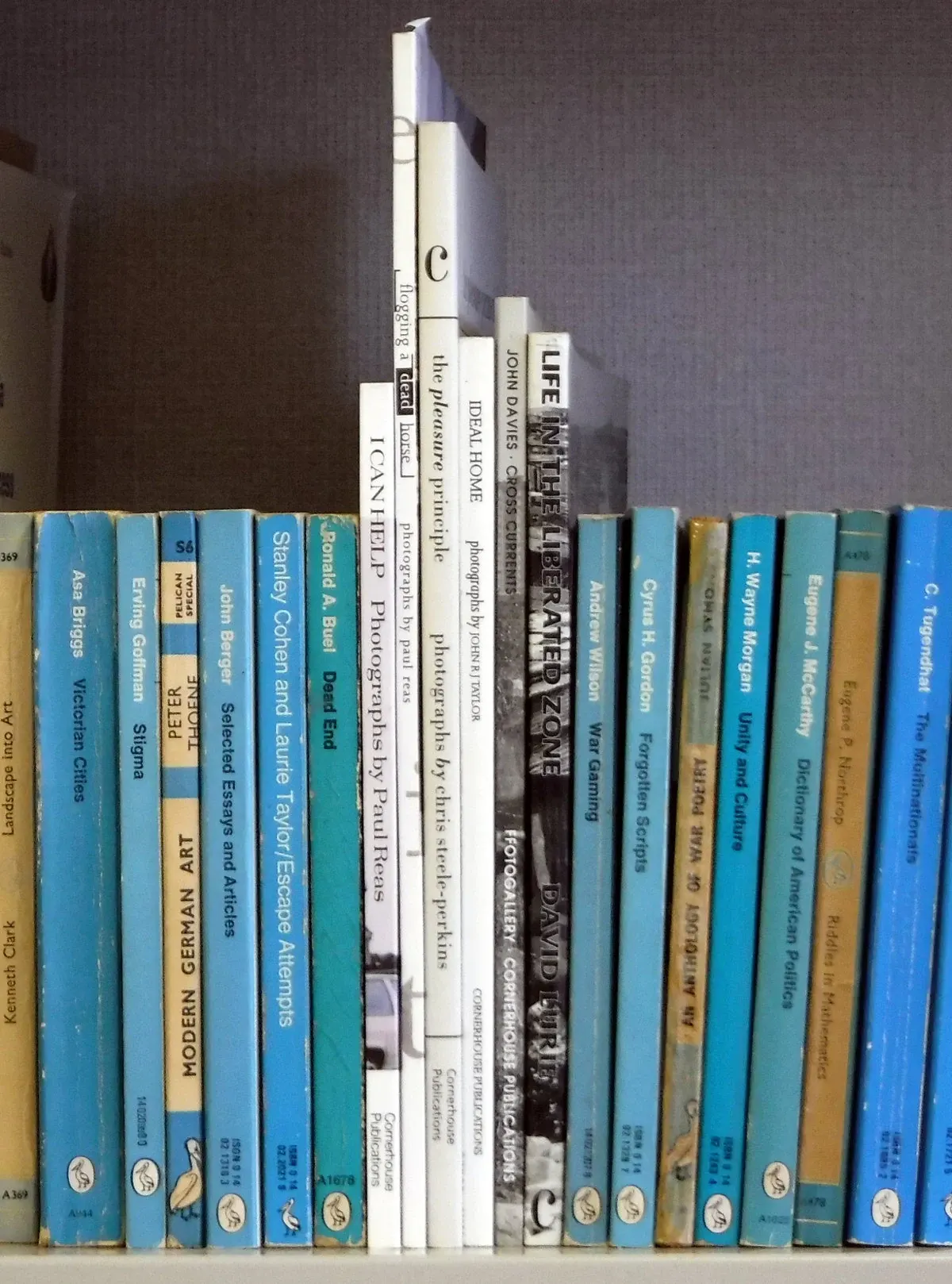Photography books on a shelf at Cornerhouse; a contextual photograph for photobook browsing