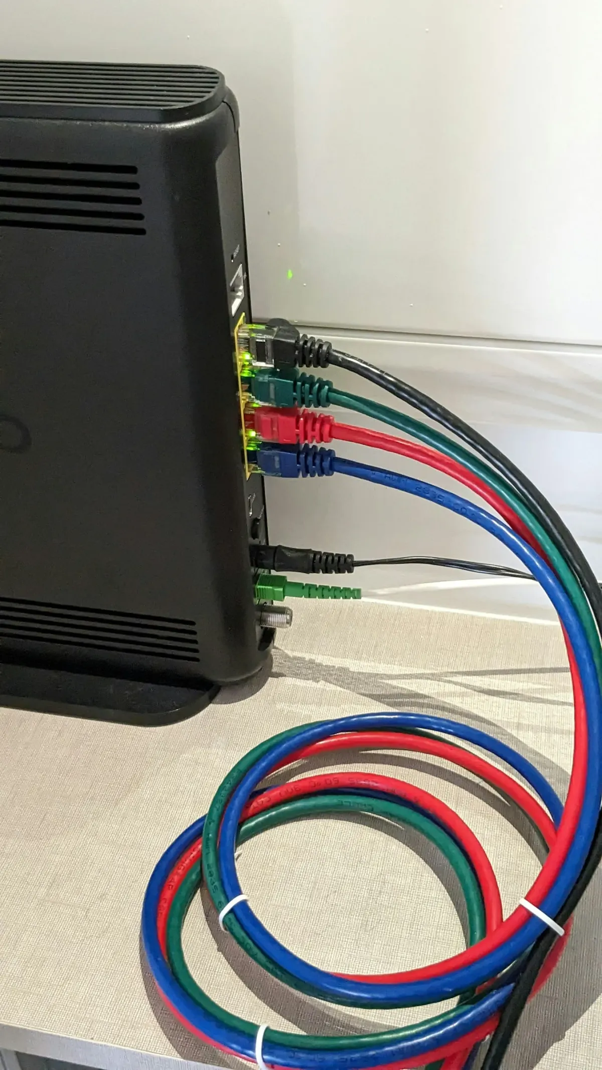 Colored Ethernet cables connected to a network router