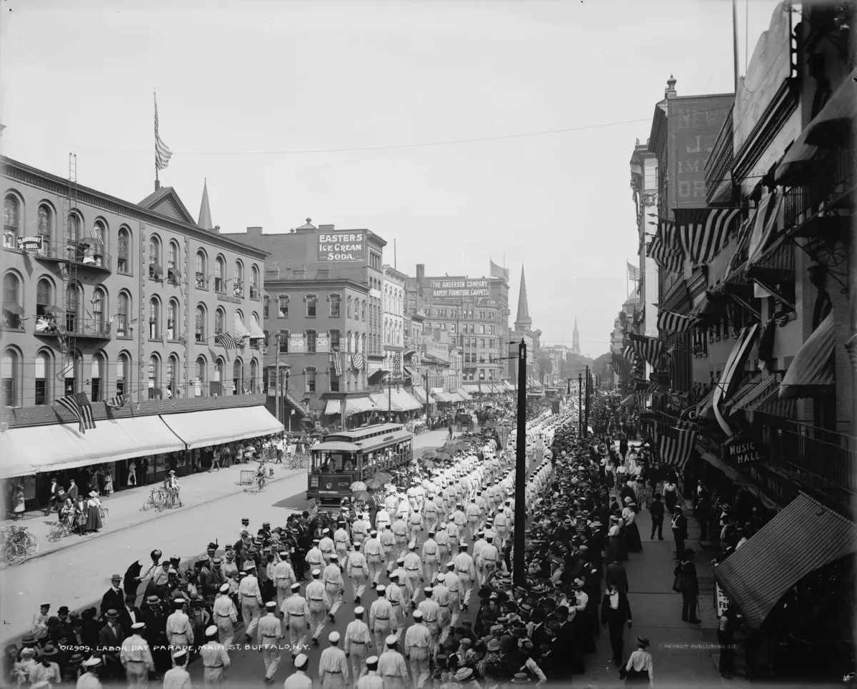An archival photograph of a Labor Day parade on Main Street in Buffalo around 1900