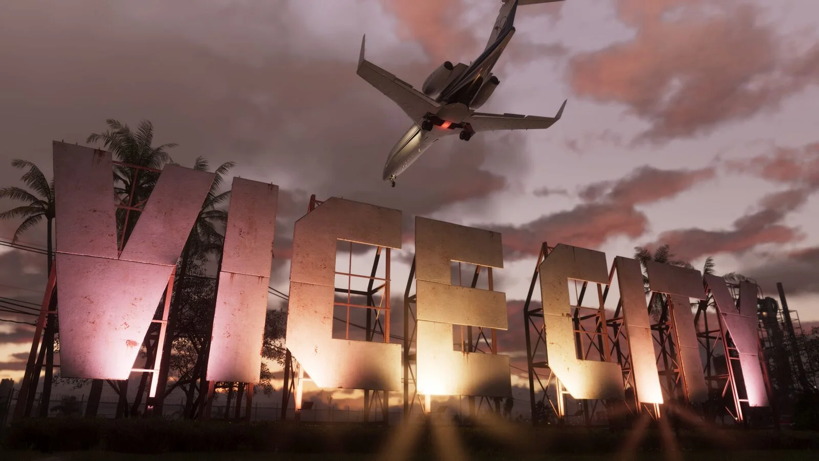 Large lit-up letters spelling Vice City at dusk, with a private jet flying low overhead, in a Grand Theft Auto VI screenshot