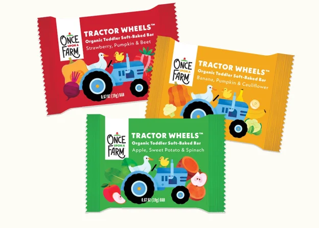 Red, yellow and green single-bar wrappers labeled Once Upon a Farm Tractor Wheels Organic Toddler Soft-Baked Bar, each showing a blue tractor