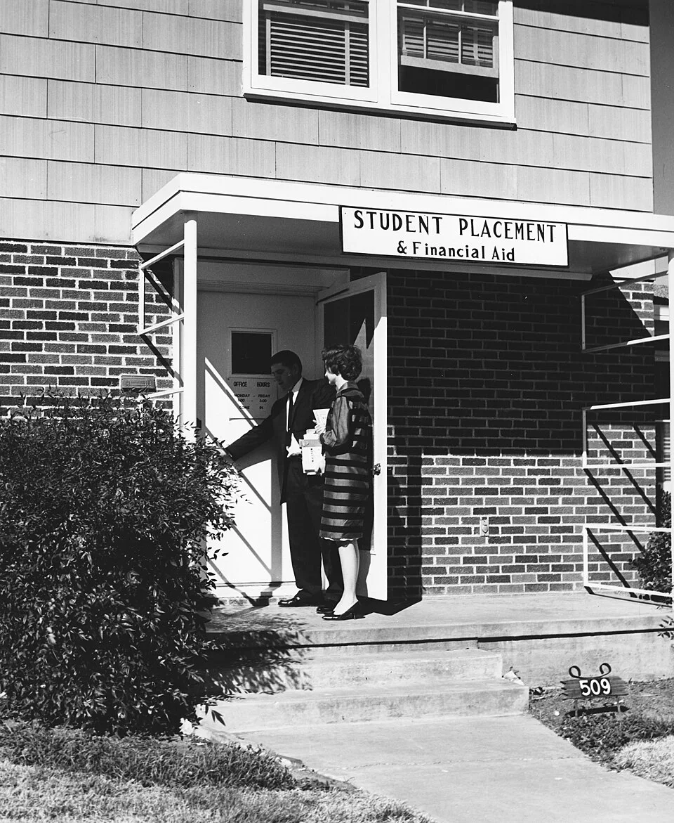 The Student Placement and Financial Aid office at the University of Texas at Arlington in an archival black-and-white photograph.