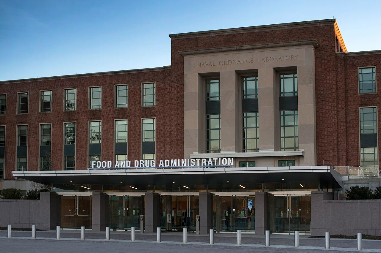 Brick entrance to FDA Building 1 in Silver Spring, Maryland, with Food and Drug Administration lettering above the doors.